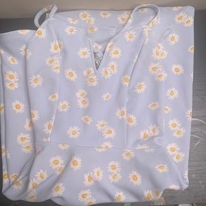 blue dress with white and yellow flowers lace backing